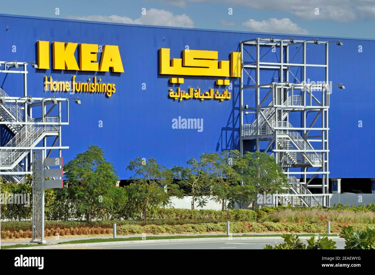 Dubai Ikea home furnishing store in modern building with bilingual Arabic signs & iconic logo external fire escape staircase United Arab Emirates UAE Stock Photo