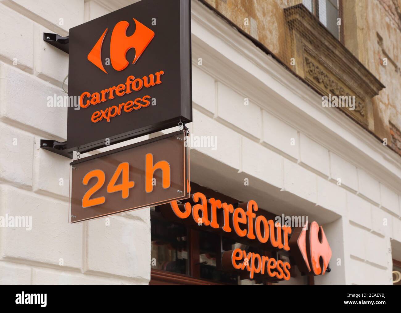 Cracow. Krakow, Poland. Carrefour Express grocery store logo on the facade of the shop. Stock Photo
