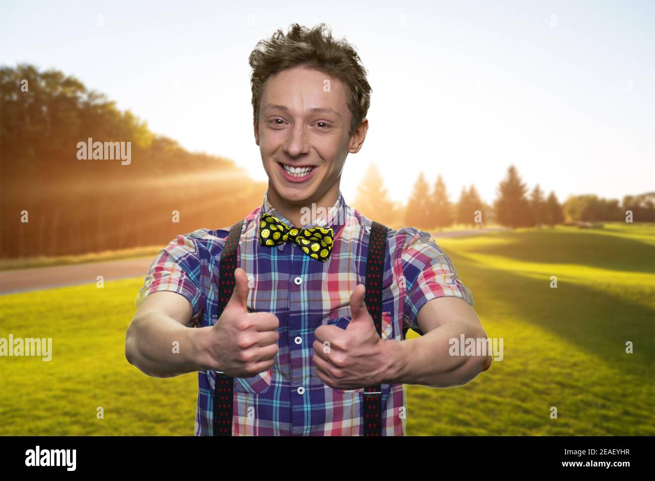 Happy young boy is showing thumbs up Stock Photo - Alamy