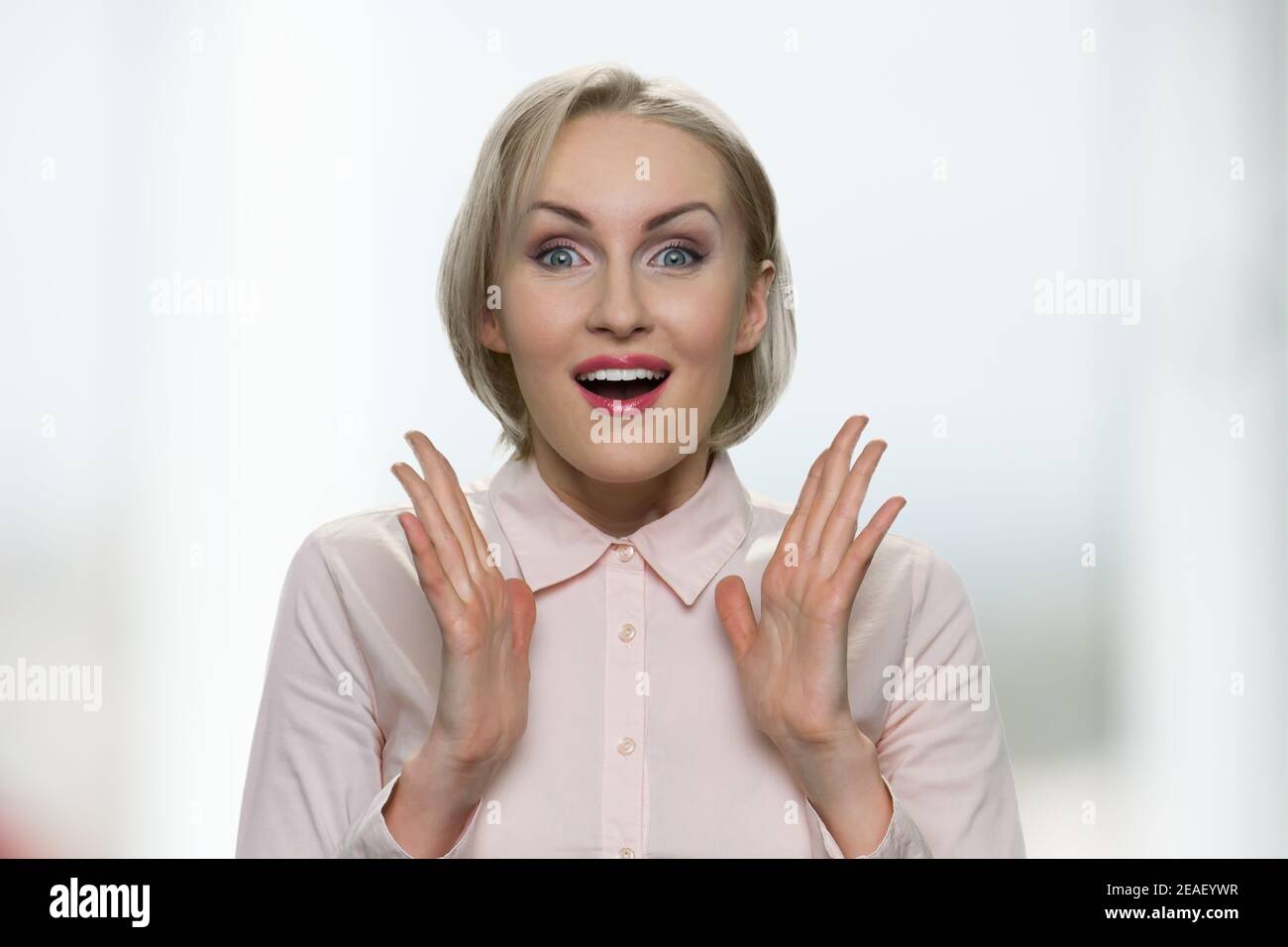 Excited businesswoman in white blouse. Stock Photo
