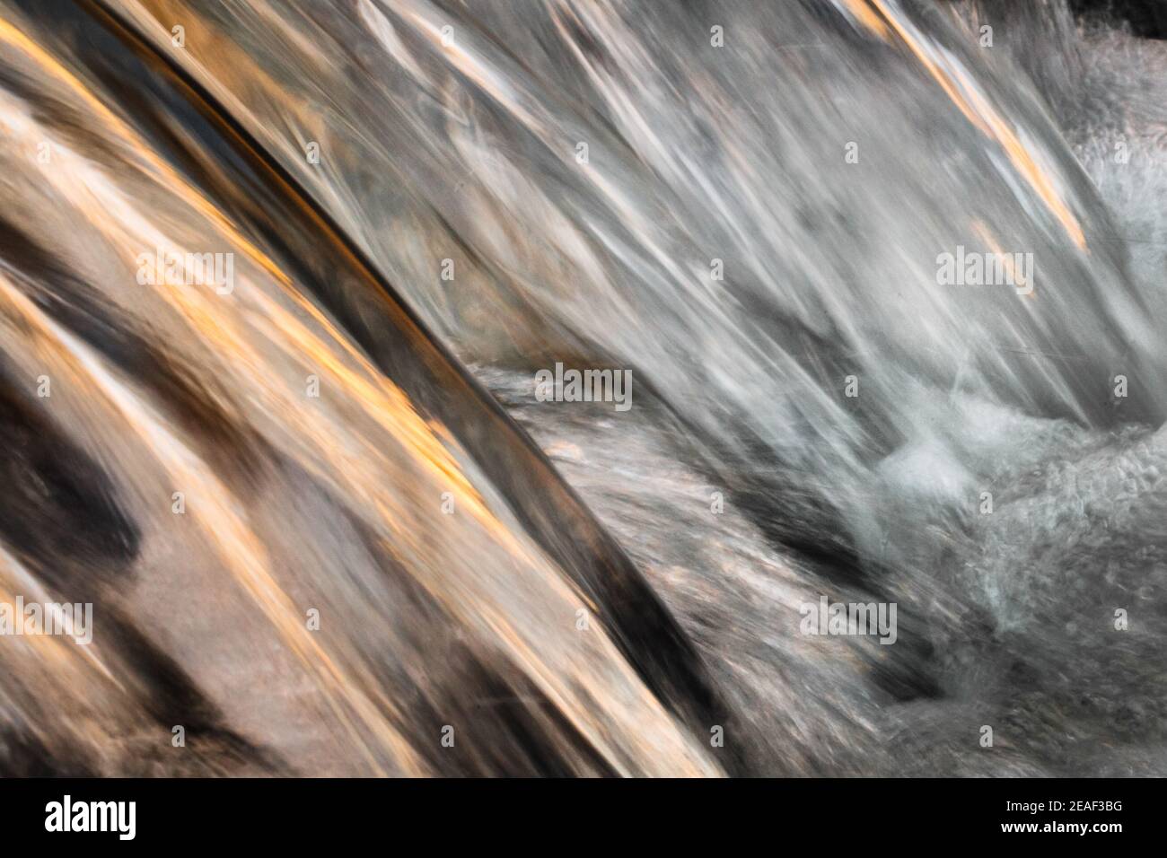 Water flowing over small lip of rock, Klipriviersberg Nature Reserve, Johannesburg, Gauteng, South Africa Stock Photo