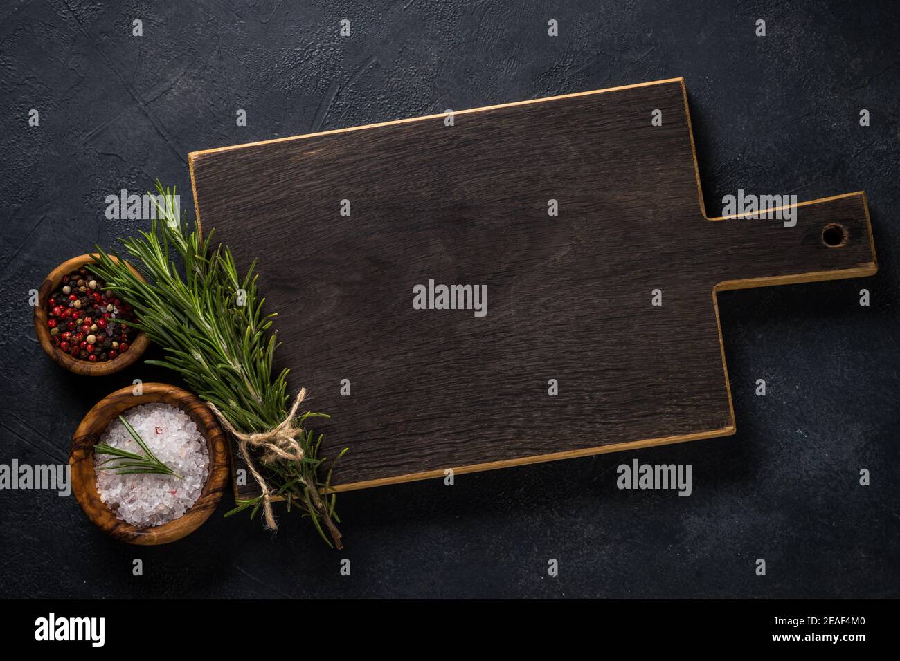 Food cooking background with herbs and spices on black Stock Photo Alamy