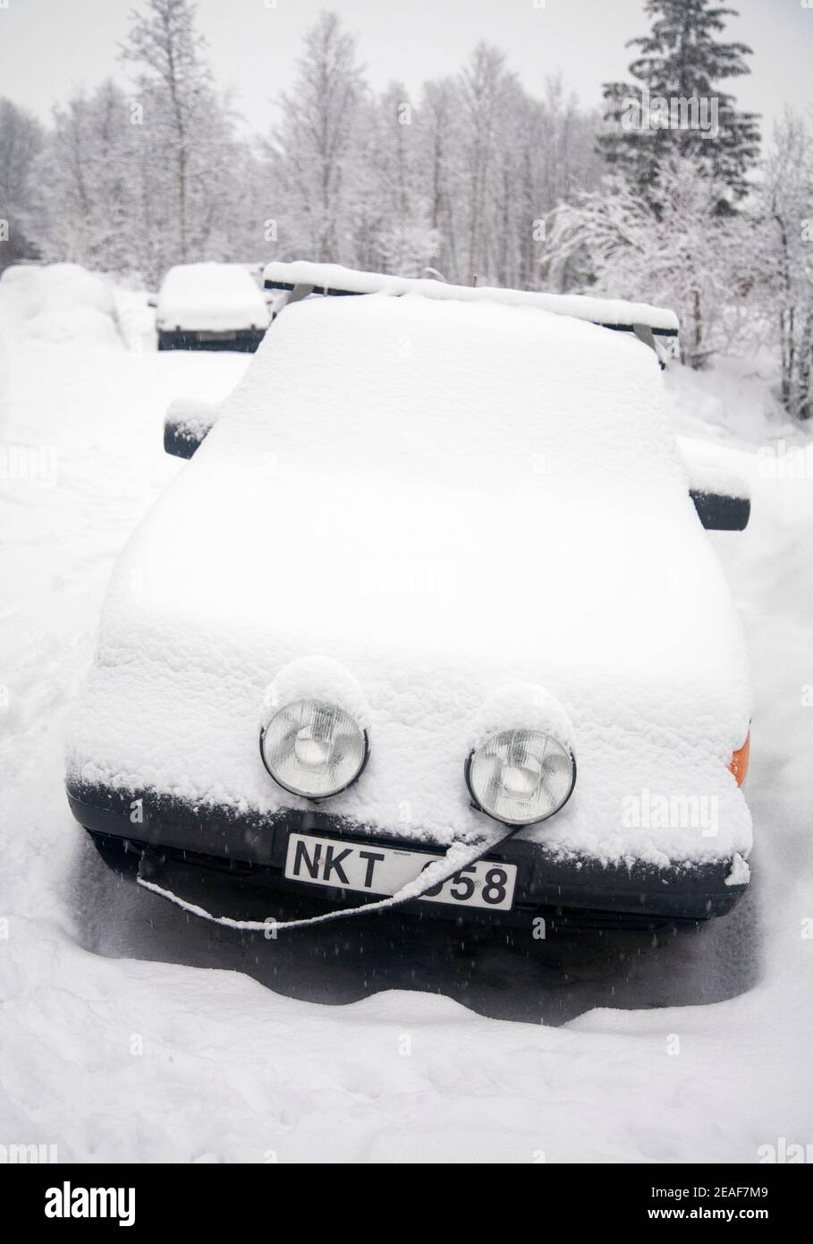 Car covered in a blanket of snow in a Norwegian street Stock Photo Alamy