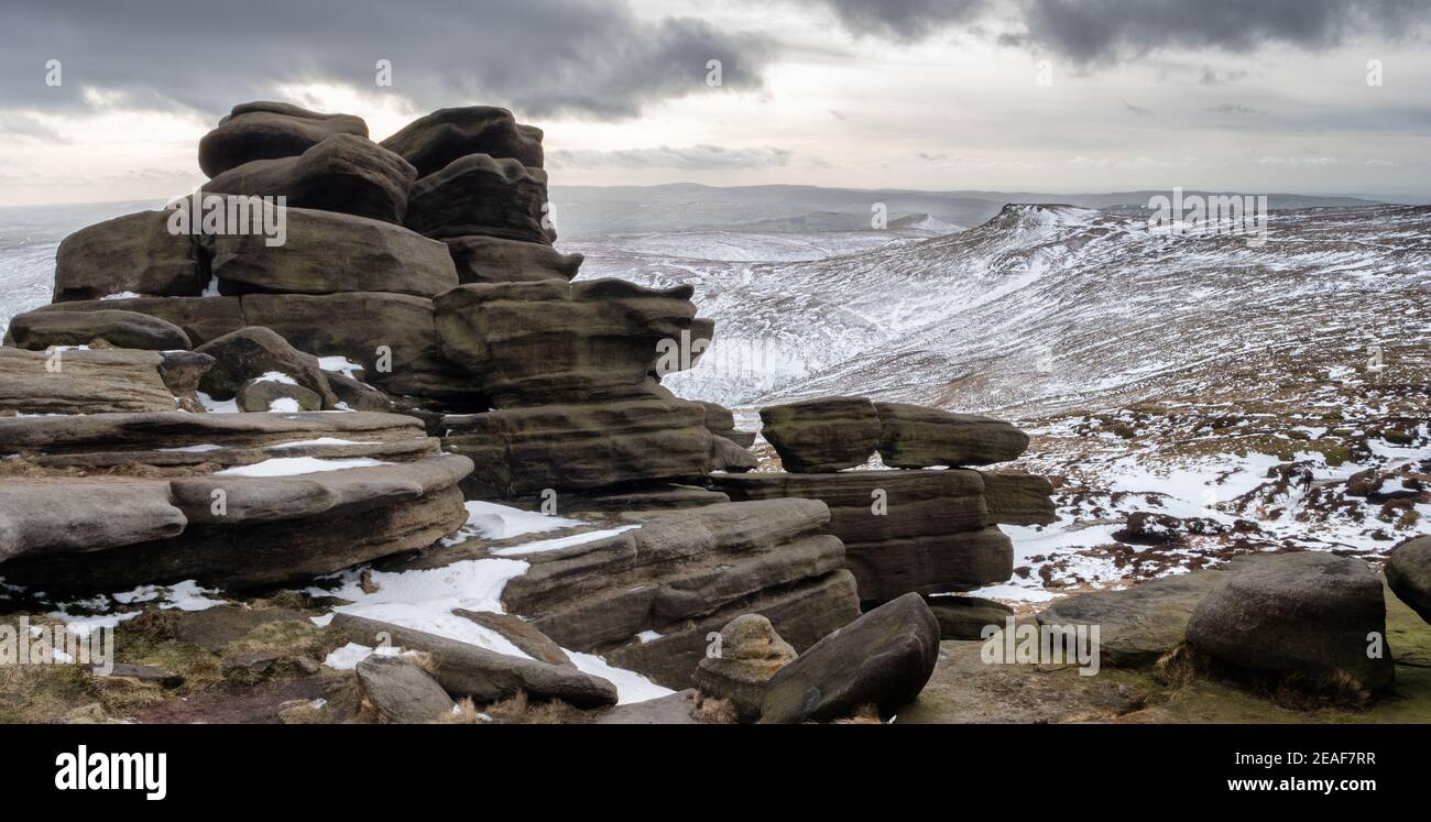 Winter view from the weathered tor at Pym Chair near Edale Head looking towards Swine's Back on Kinder Scout in the Derbyshire Peak District Stock Photo