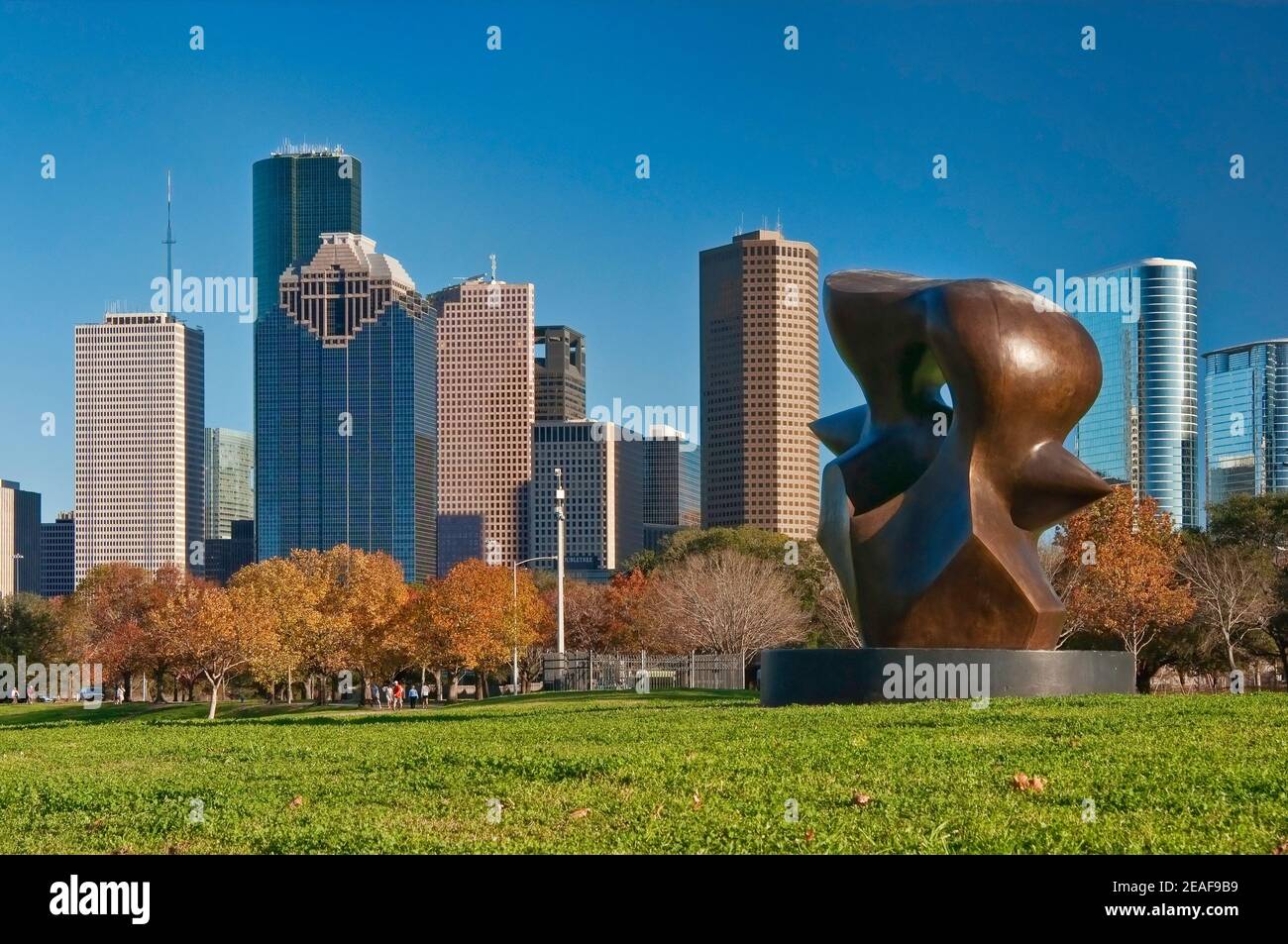 Large Spindle Piece sculpture by Henry Moore, Buffalo Bayou Park, Allen Parkway, with Downtown skyline in distance, Houston, Texas, USA Stock Photo