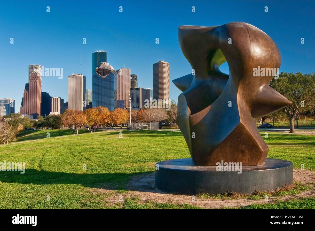 Large Spindle Piece sculpture by Henry Moore, Buffalo Bayou Park, Allen Parkway, with Downtown skyline in distance, Houston, Texas, USA Stock Photo
