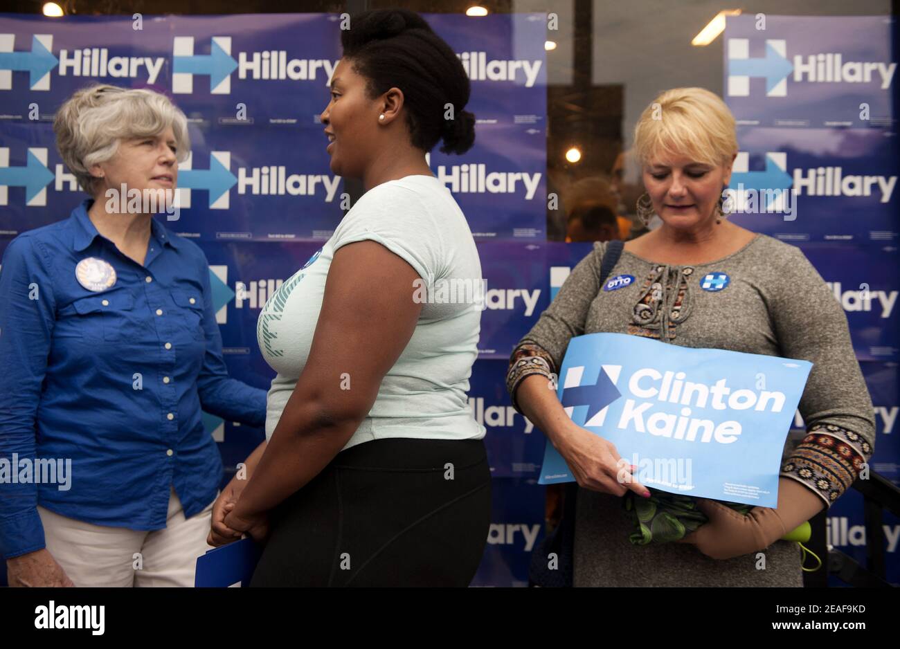 Anne Taussig (left) of St. Louis, Myra Lewis of St. Louis and LaDonna Appelbaum of Chesterfield join the overflow crowd gathering on the sidewalk alon Stock Photo