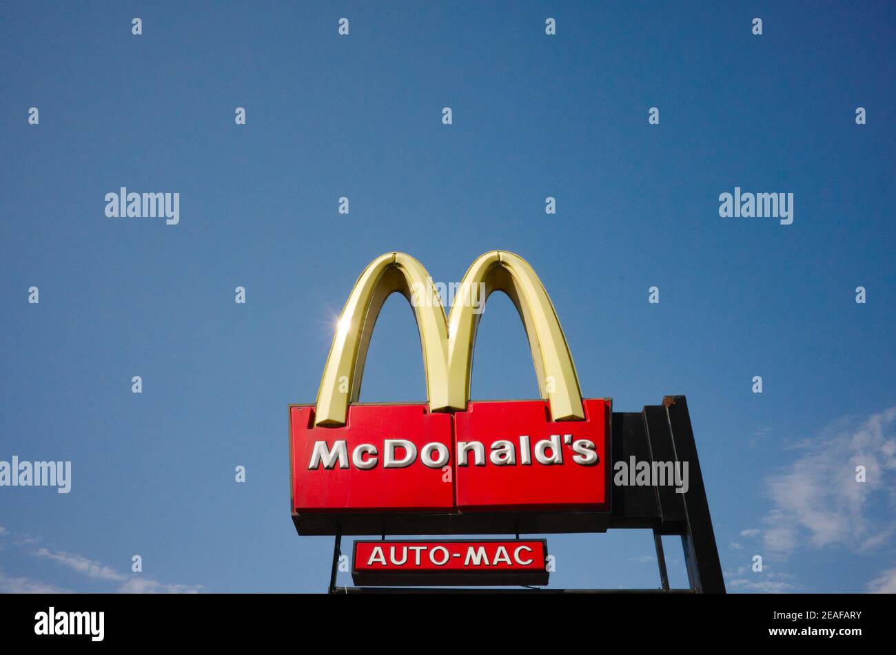 Buenos Aires, Argentina - January, 2020: Big Mcdonalds logo outside against blue sky. Auto mac sign under it. Stock Photo