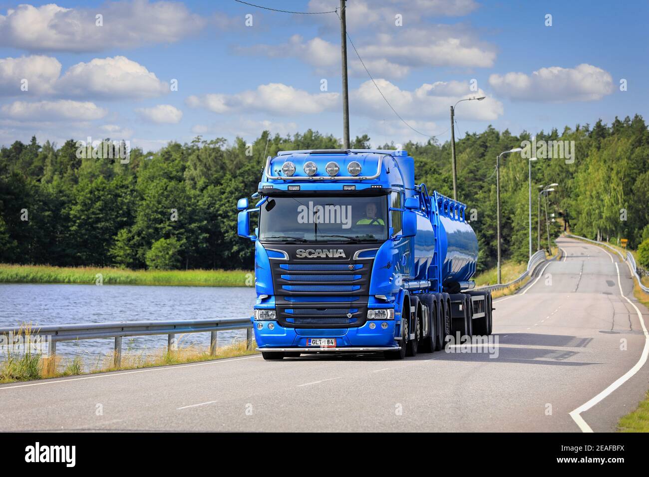 Blue Scania R580 bulk transporter tank truck of Hänninen Group Oy on Särkisalo bridge on a beautiful day of summer. Salo, Finland. July 19, 2020. Stock Photo