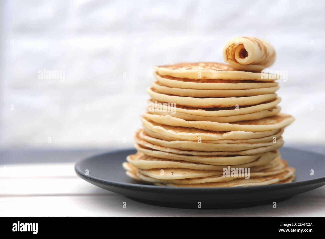 stack of classic american pancakes on a wooden rack. traditional family ...
