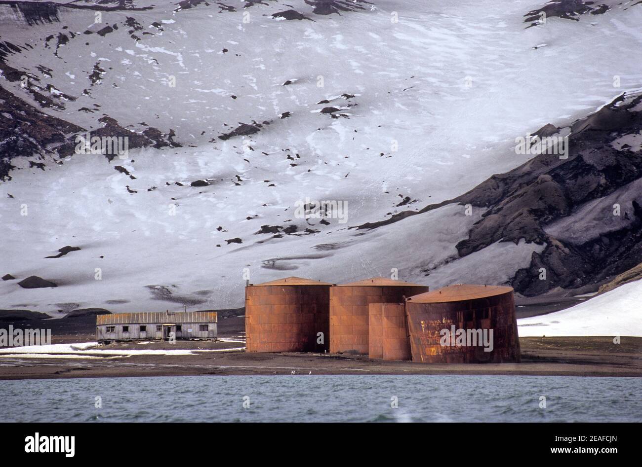 Silos and a house of a former whaling factory on Whalers Bay in Deception Island in Antarctica Stock Photo