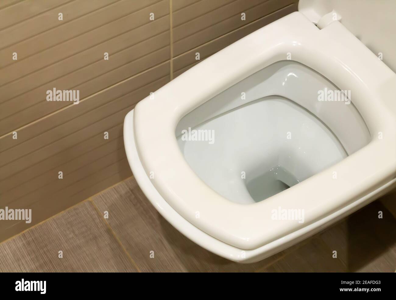 Open ceramic white toilet bowl closeup Stock Photo Alamy