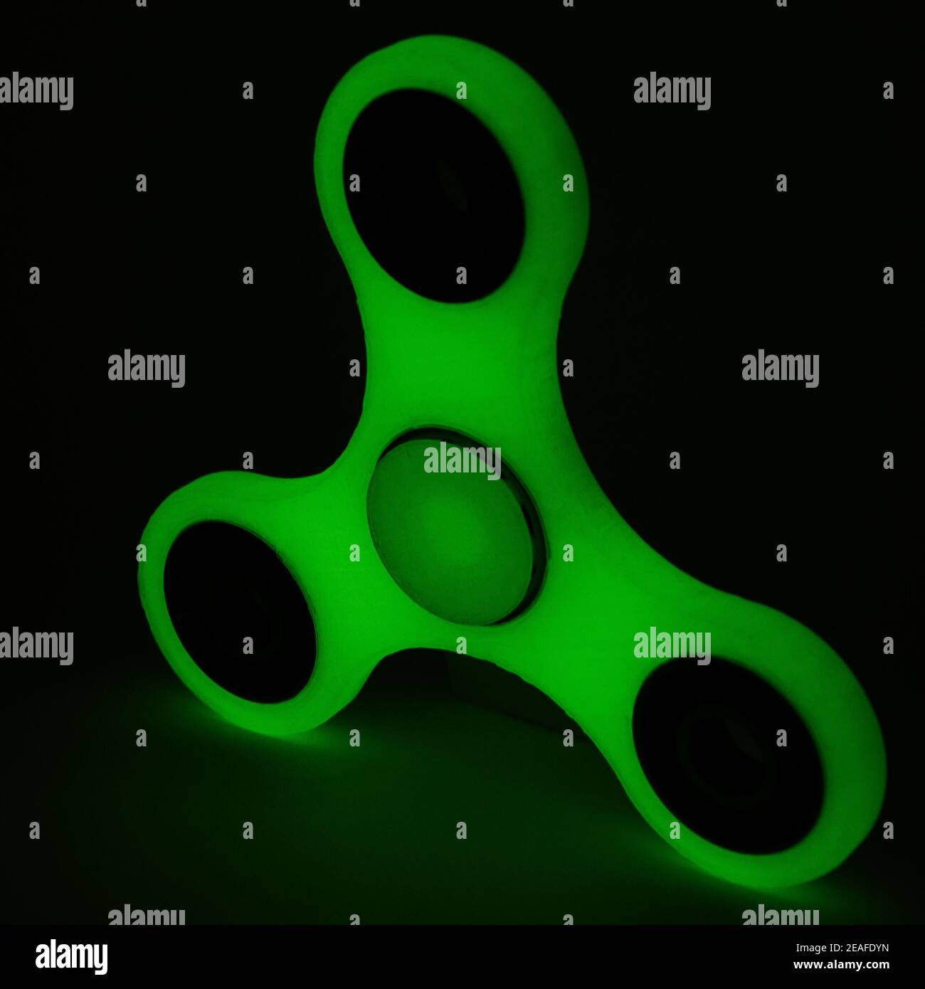 Glowing fidget spinner to relax, relieve stress, play  Stock Photo