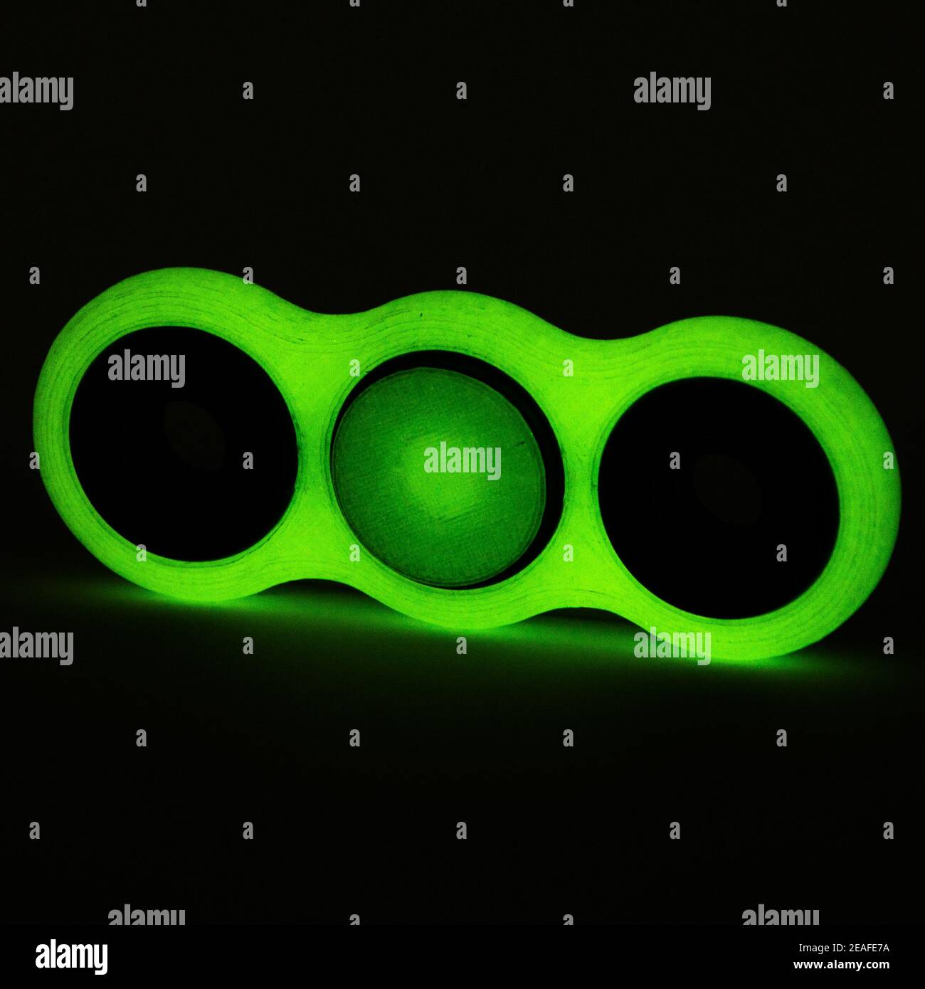 Glowing fidget spinner to relax, relieve stress, play  Stock Photo