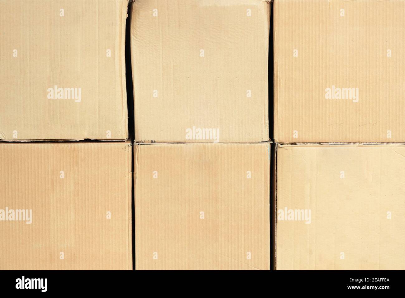 Square cardboard boxes in two rows in full screen. Front view with copy