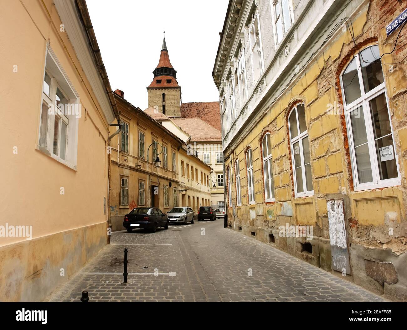 Old street in the city of Brasov, which is located in the central part of the Romania, about 166 kilometres north of Bucharest. Stock Photo