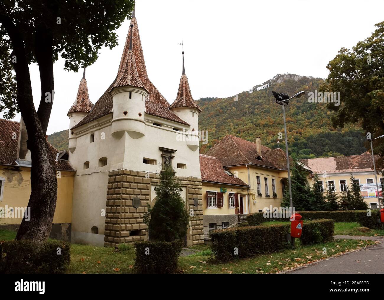 The old tower and gate in the city of Brasov, which is located in the central part of the Romania, about 166 kilometres north of Bucharest. Stock Photo