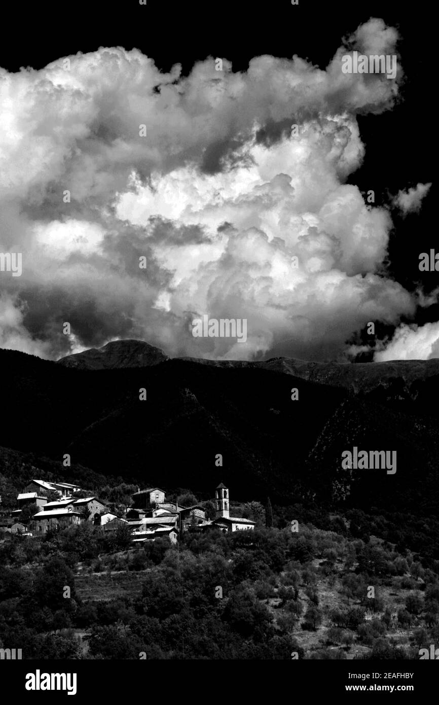 Vertical grayscale shot of a cloudy sky over the city Stock Photo - Alamy