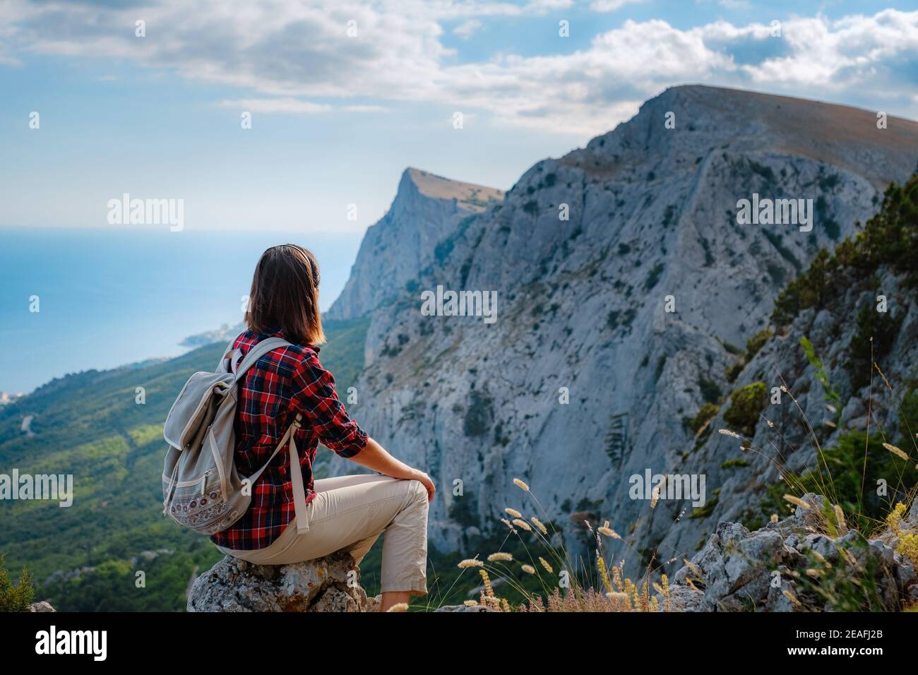 woman hiker enjoy the view at mountain 