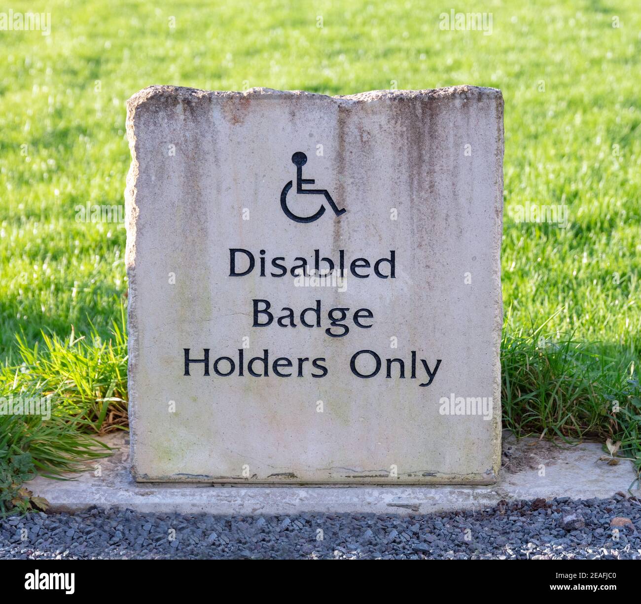 Stone Disabled Badge Holders Only parking sign Stock Photo