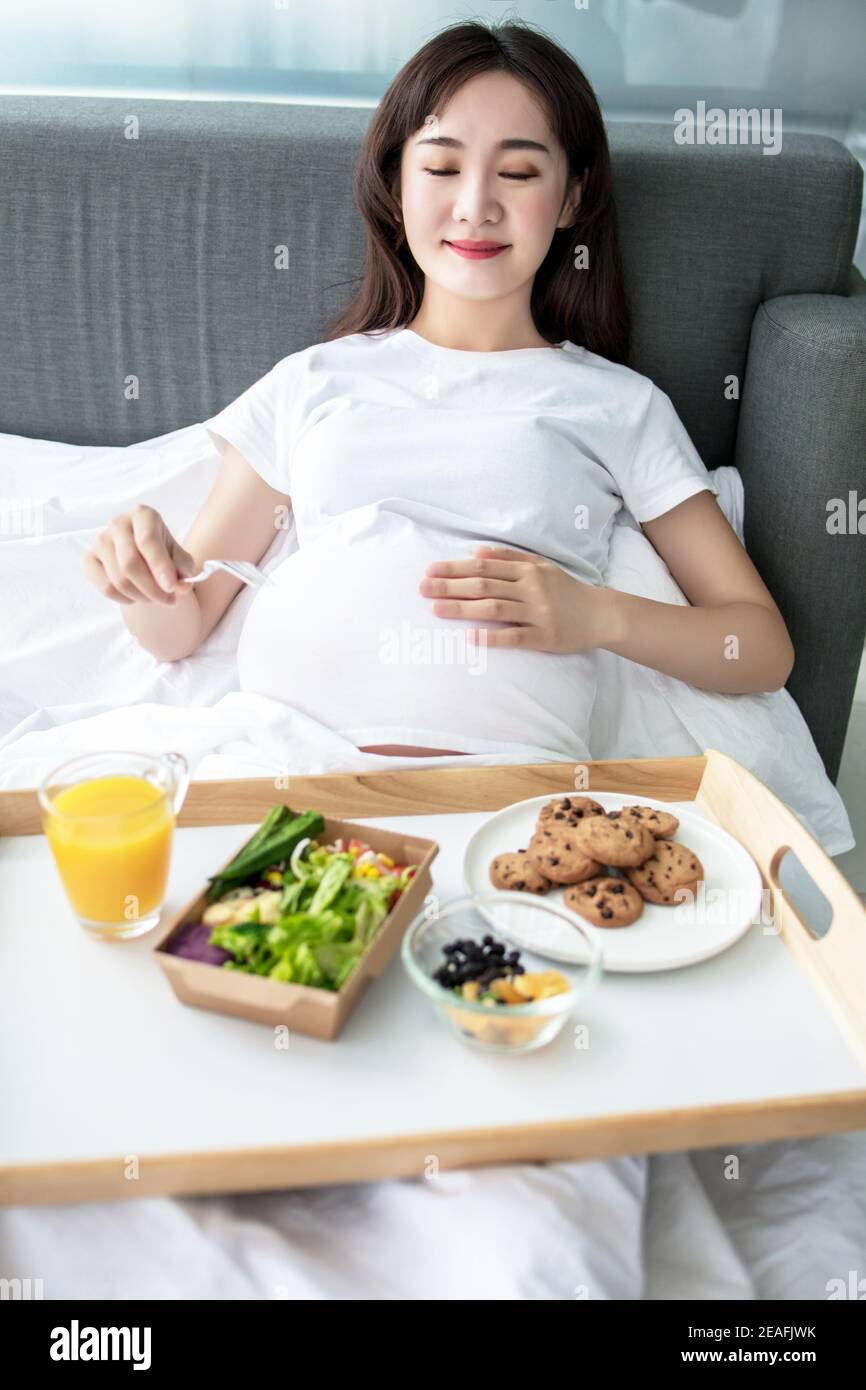 pregnancy, healthy food and people concept close up of happy pregnant