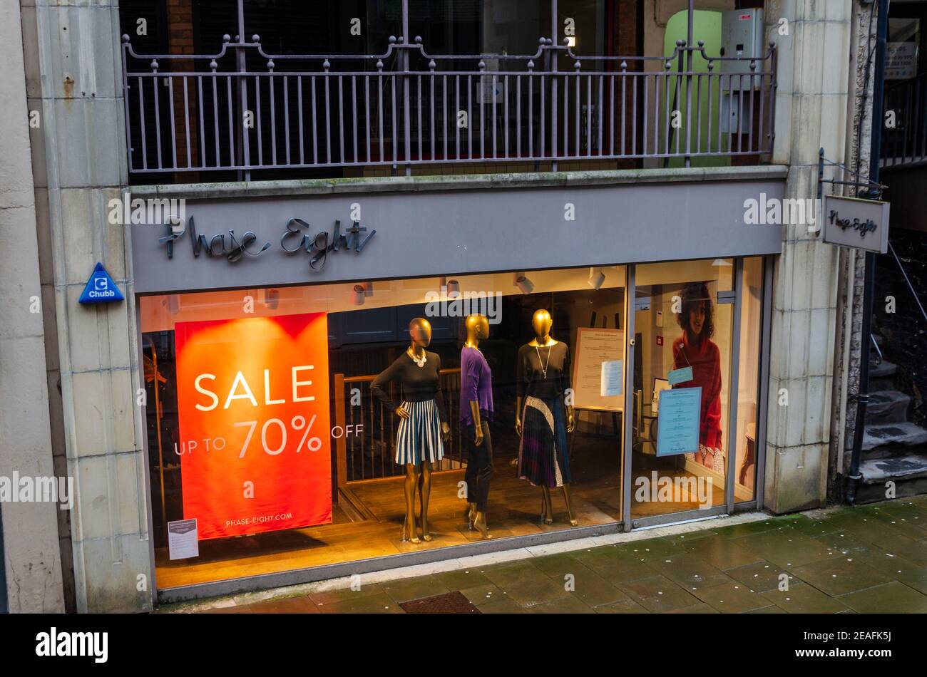 Chester; UK: Jan 29, 2021: The Phase Eight store on Watergate Street has window displays advertising a sale with up to 70% off. They are currently tem Stock Photo