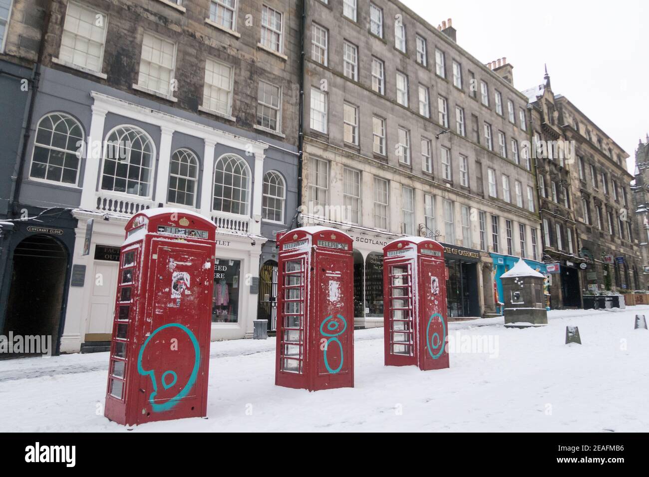 Traditional red phone boxes, now left unused, seen on the Royal Mile in Edinburgh, Scotland, UK Stock Photo