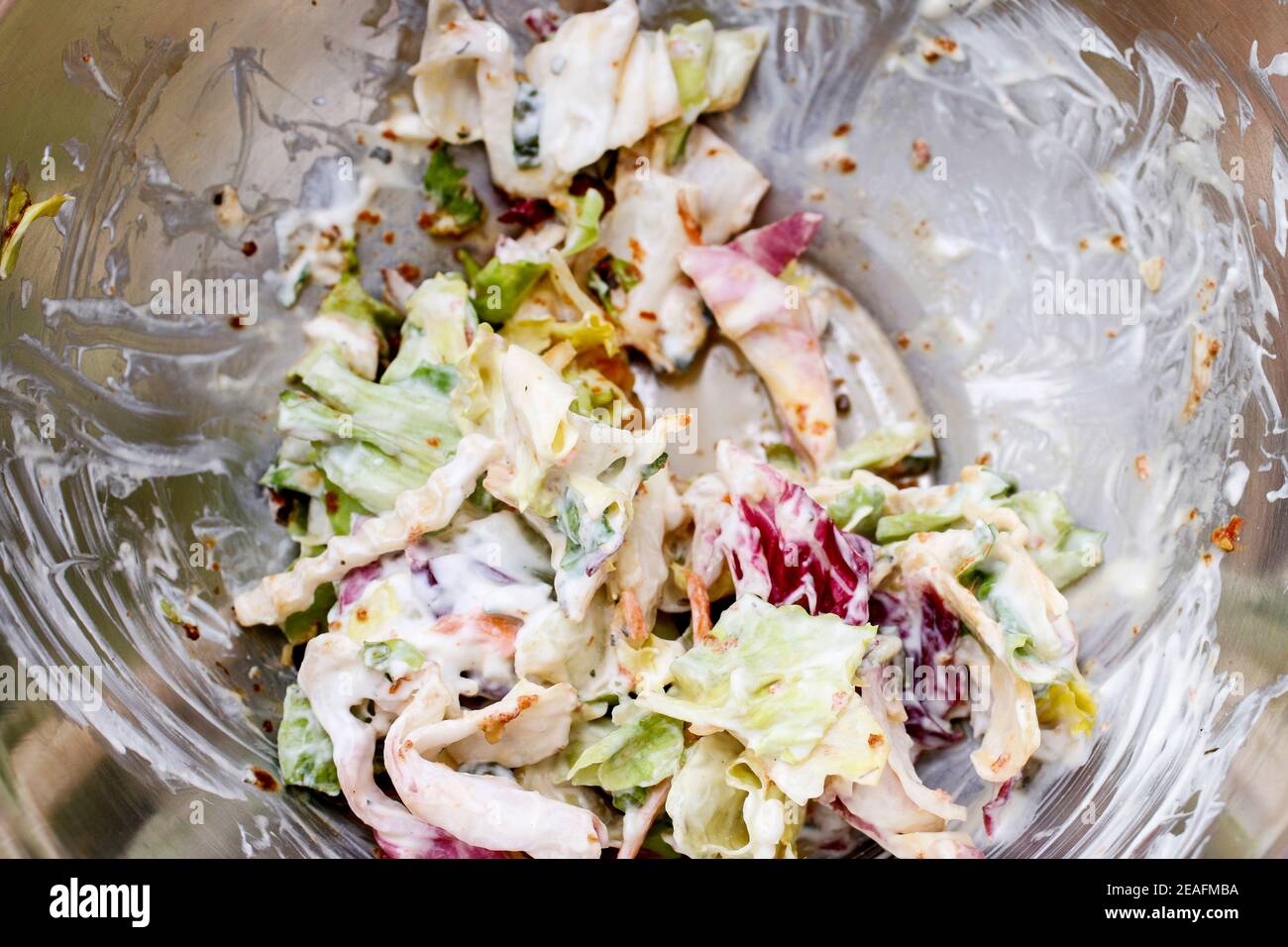 Vegetable salad with mayonnaise in silver bowl. Healthy food Stock