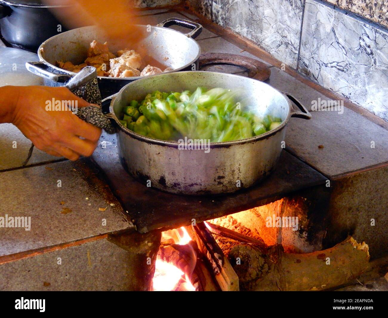 Cooking okra on the wood stove Stock Photo Alamy