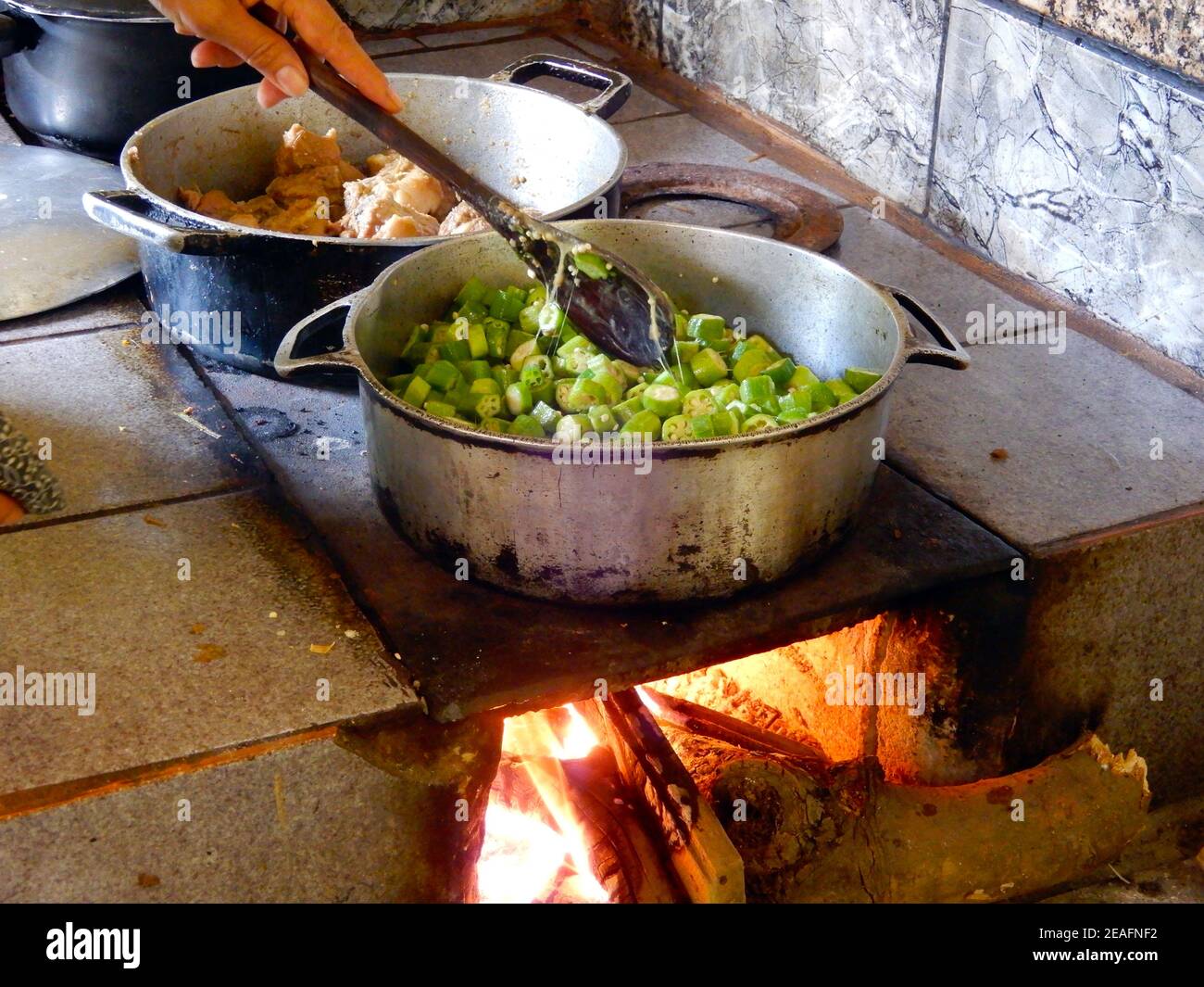 Cooking okra on the wood stove Stock Photo Alamy