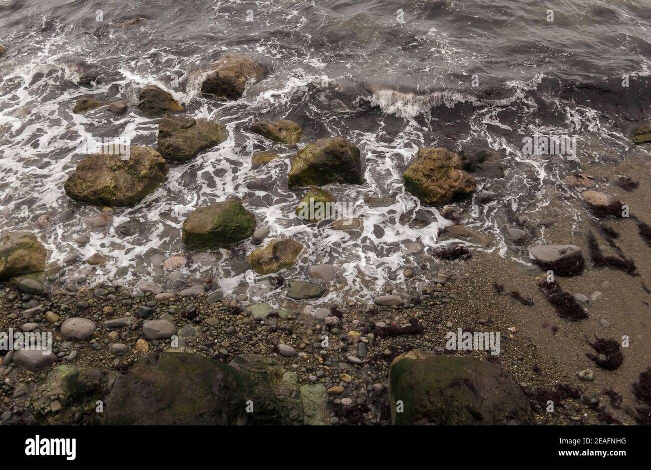 Top view of waves hitting a rocky seasho Stock Photo - Alamy