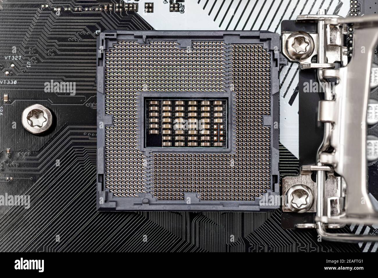 Top macro shot of empty modern LGA 1200 socket for CPU on black desktop motherboard. Stock Photo