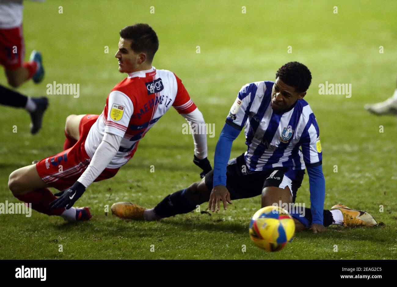 Wycombe Wanderers' Anis Mehmeti goes down in the penalty area after a challenge from Sheffield Wednesday's Kadeem Harris during the Sky Bet Championship match at Hillsborough, Sheffield. Picture date: Tuesday February 9, 2021. Stock Photo