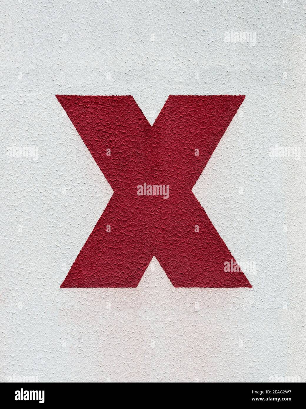 Bold red letter X on white Stock Photo