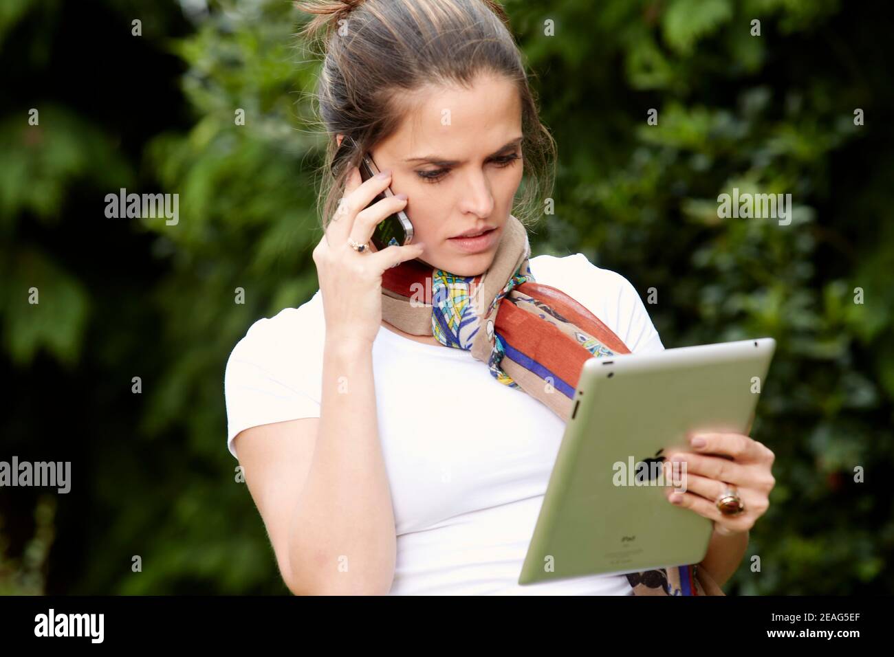 Businesswoman using iPad Stock Photo
