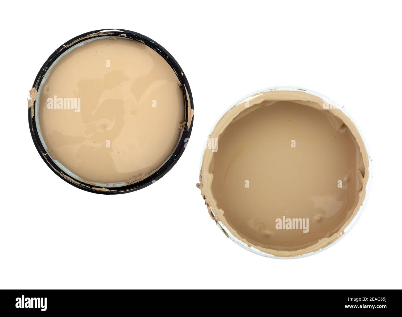Top view of an open container of beige paint with the lid to the side isolated on a white background. Stock Photo