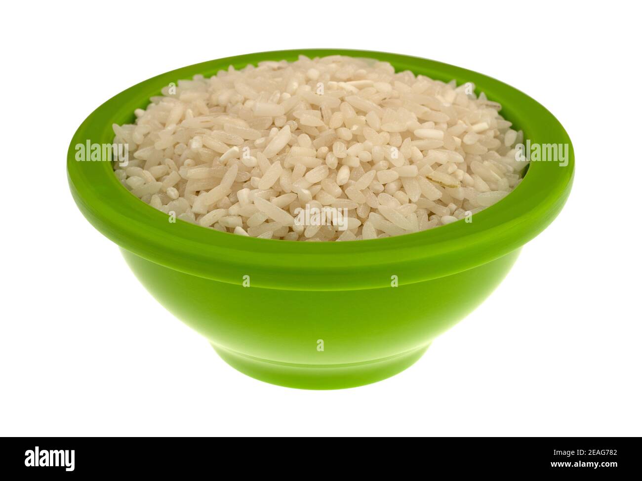 Side view of enriched long grain rice in a small green bowl isolated on a white background. Stock Photo