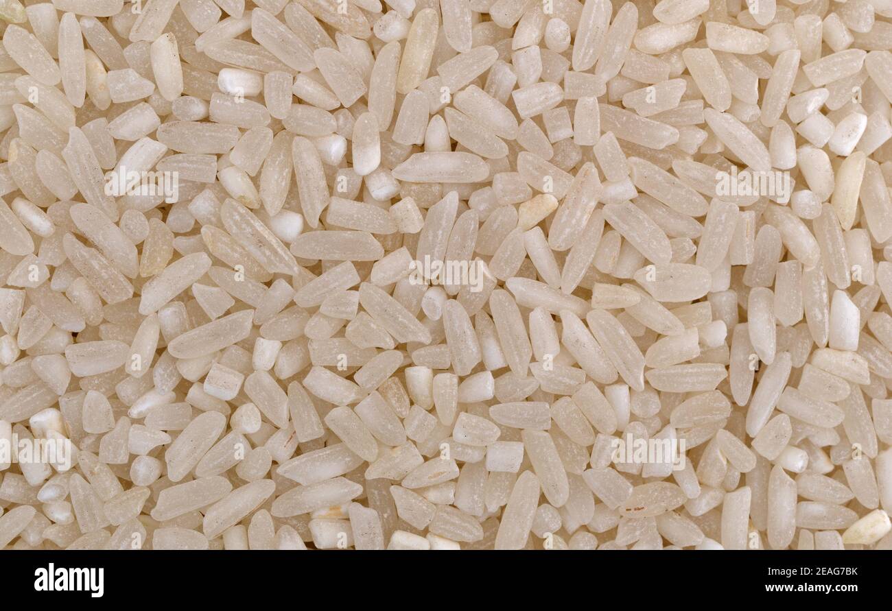 Very close view of enriched long grain rice Stock Photo - Alamy