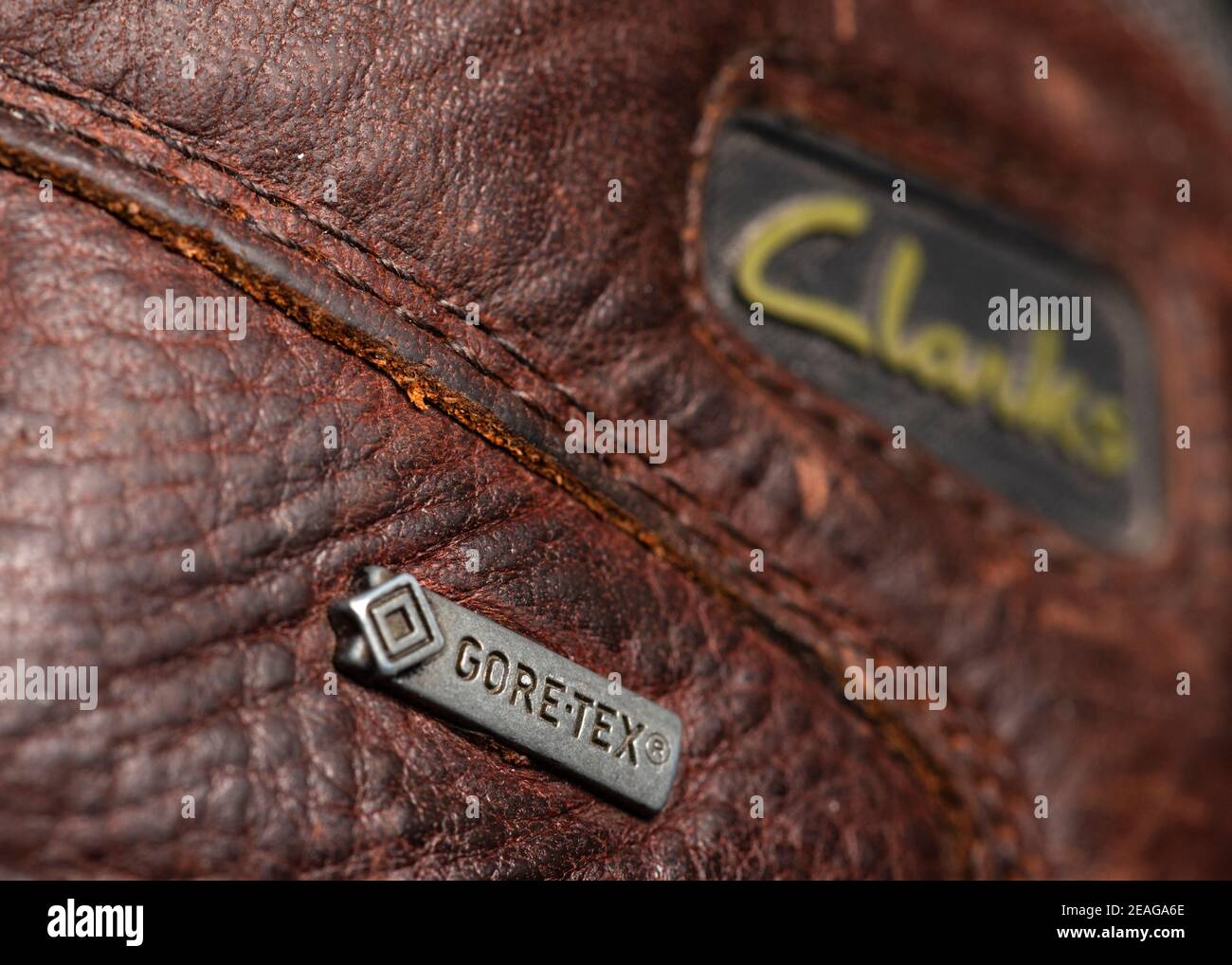 Clarks shoes. Gore-tex metal badge on Clarks Outdoor waterproof men's brown  leather hiking boots close up detail Stock Photo - Alamy