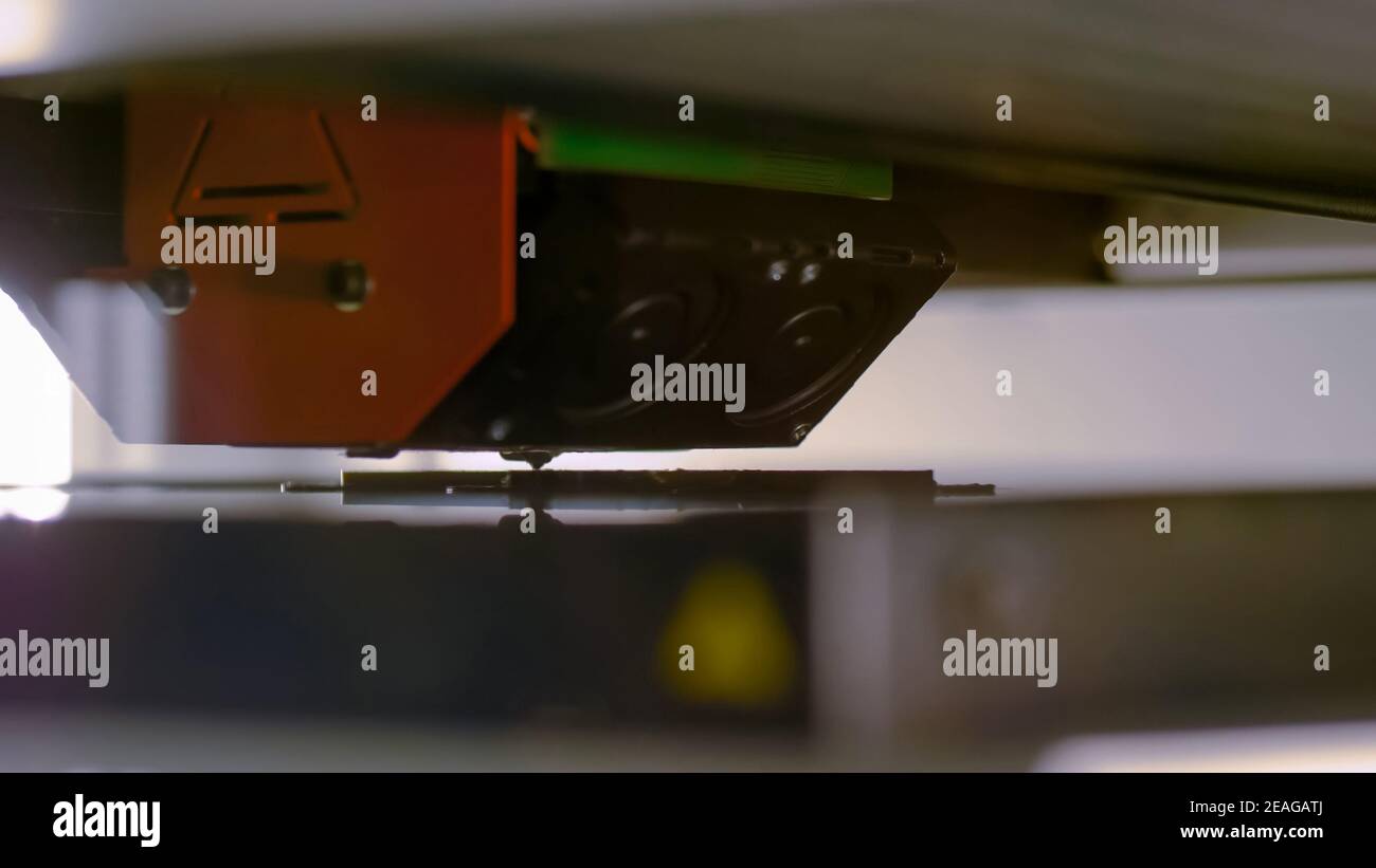 Three dimensional printing machine prints physical flat 3D model at factory Stock Photo