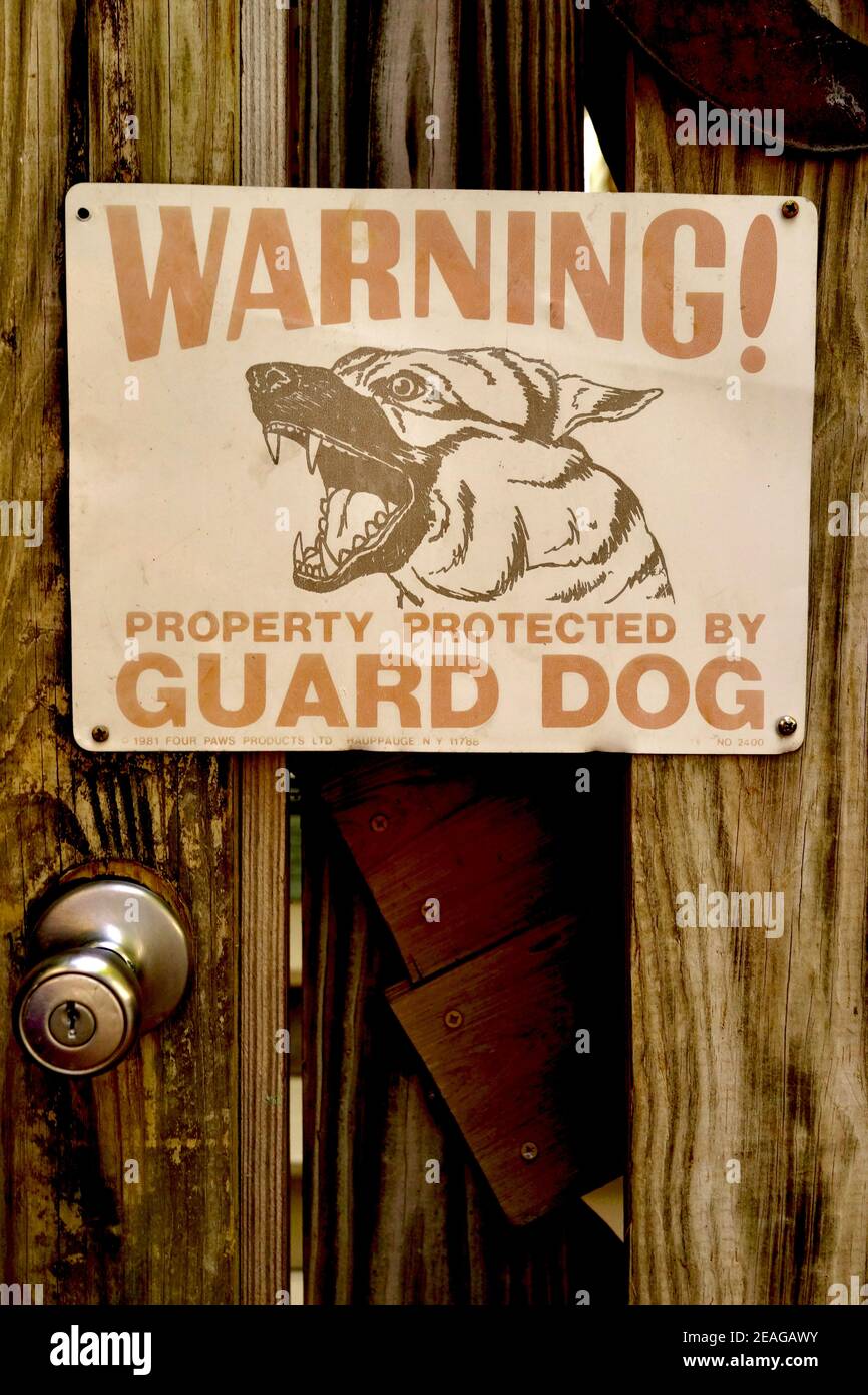 Guard Dog sign in Key West, Florida, FL USA.  Southern most point in the continental USA.  Island vacation destination for relaxed tourism. Stock Photo