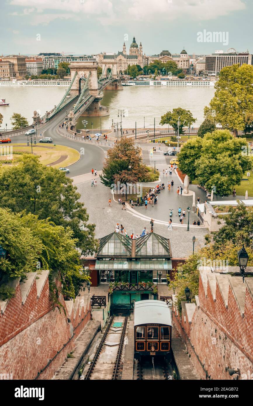 Cityscape of Budapest with the Chain bridge, St. Stephen's Basilica and castle hill cable car station Stock Photo