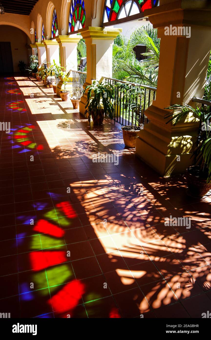 Stained glass reflections on the ground in a building in Camagüey, Cuba Stock Photo