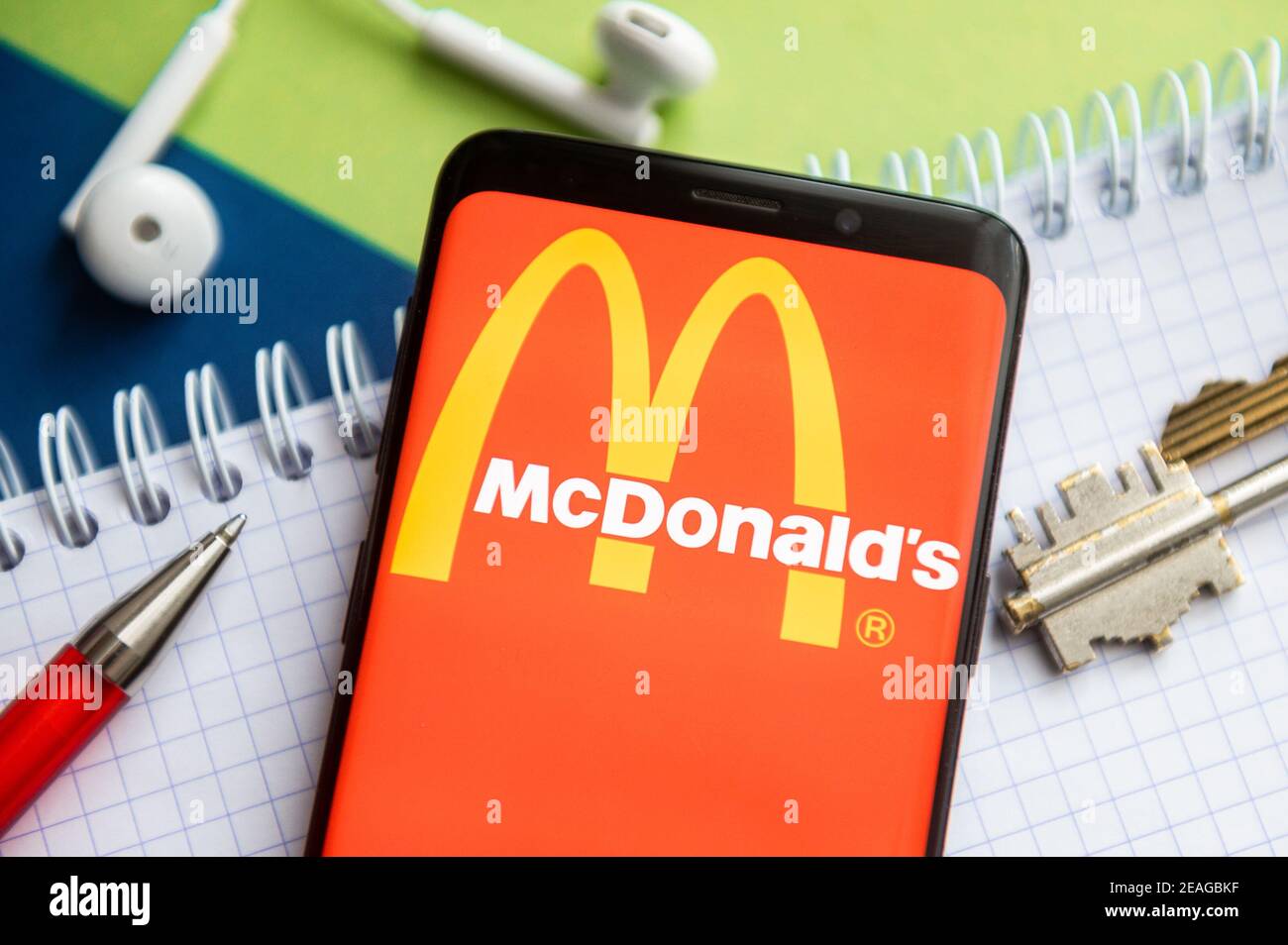 In this photo illustration, a Mc Donald's logo seen displayed on a ...