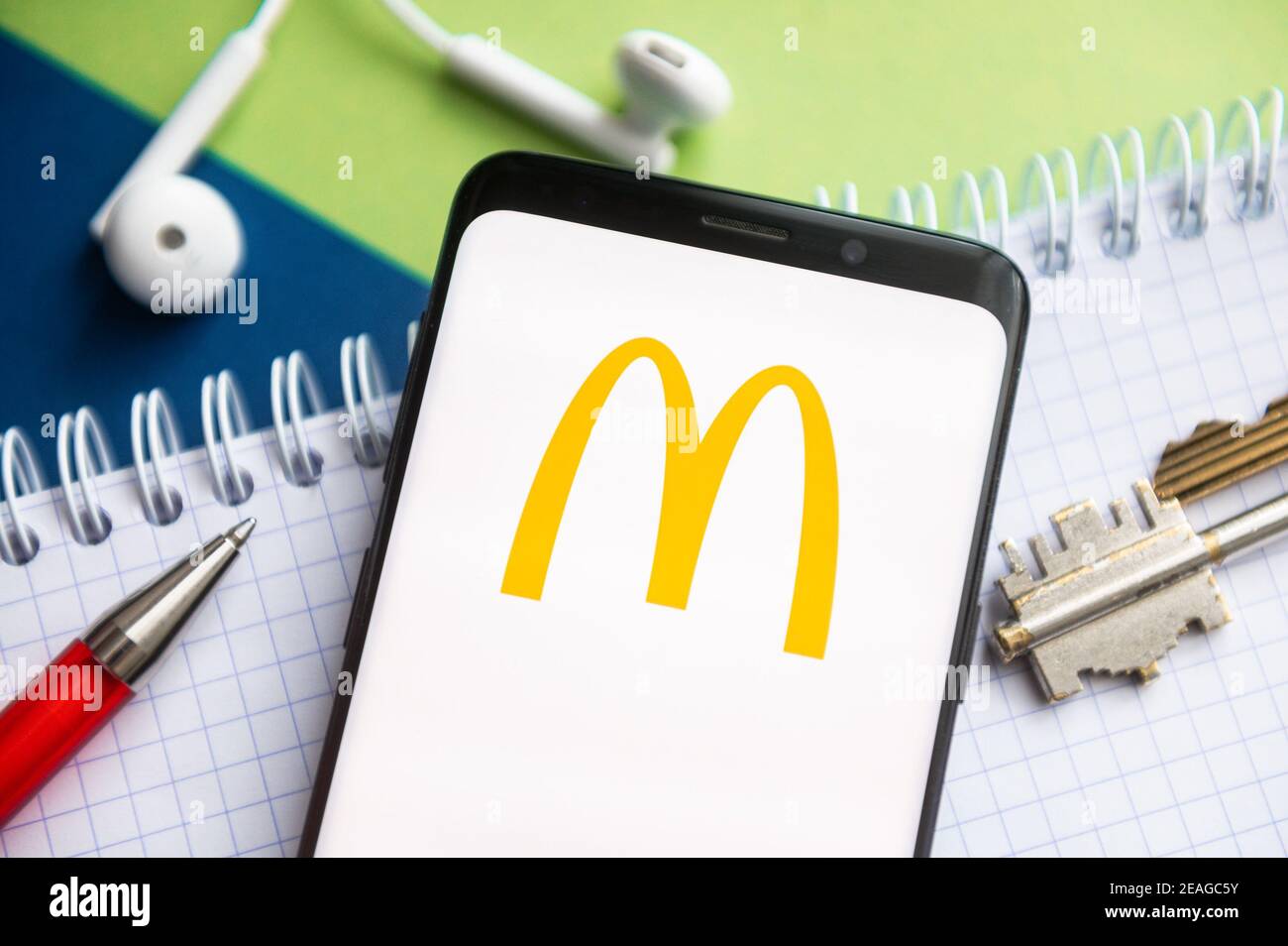 In this photo illustration, a Mc Donald's logo seen displayed on a ...