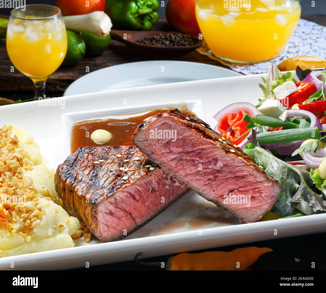 Grilled meat with trimmings Stock Photo Alamy