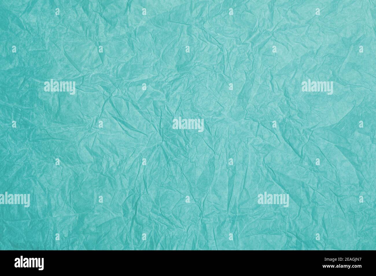 Old crumpled turquoise paper background texture Stock Photo