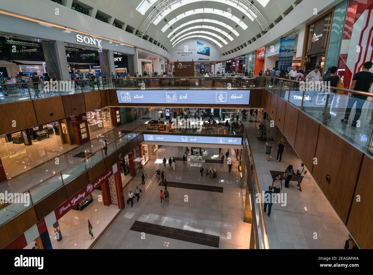 Dubai, UAE - 12.01.2019: People walking by and shopping inside of the Dubai Mall. Several shopping floors, busy as usual. Stock Photo