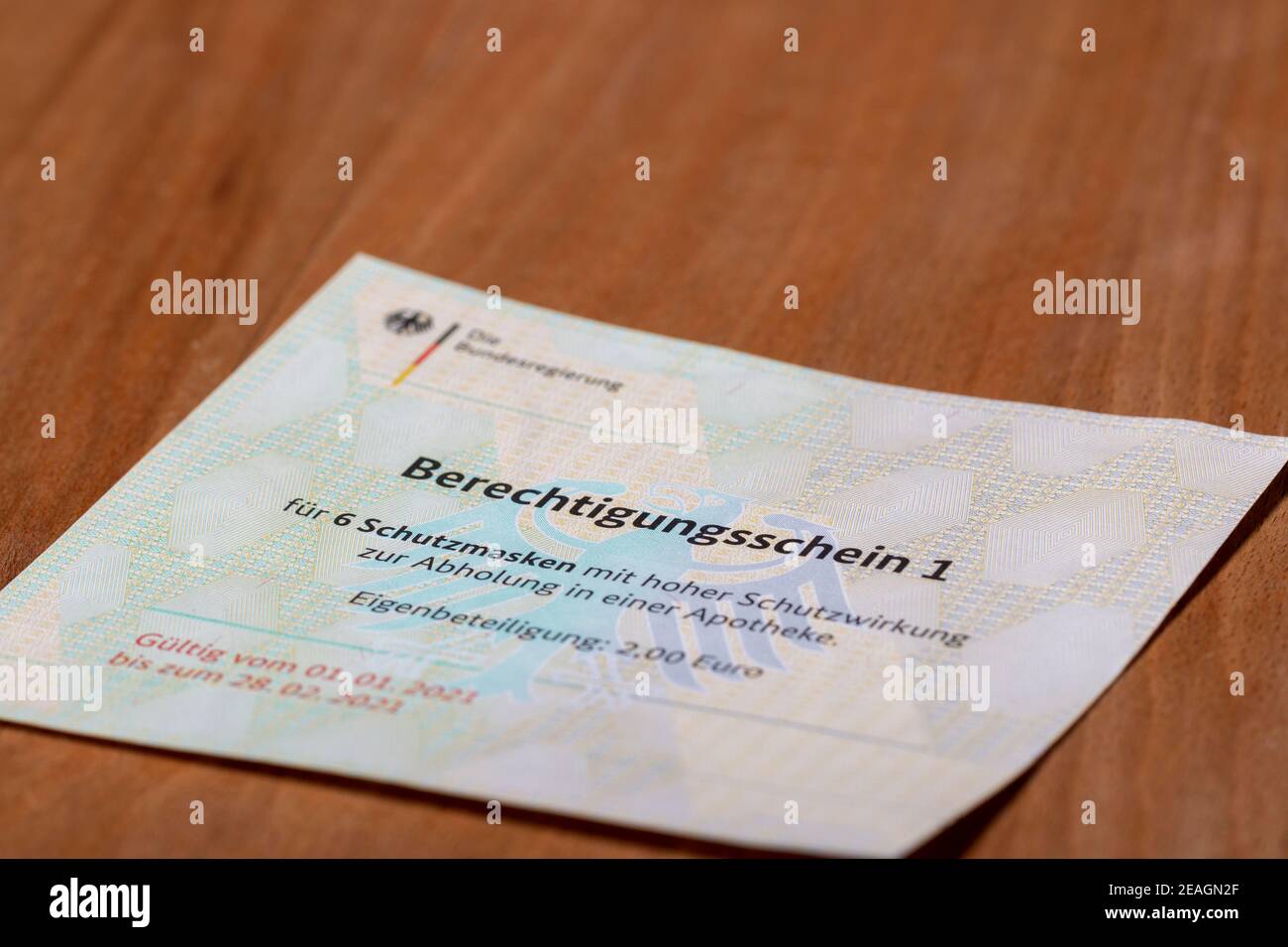 Stuttgart,Germany- February 09.2021:Closeup of german government entitling certificate for ffp2 protection masks purchase warrant Stock Photo