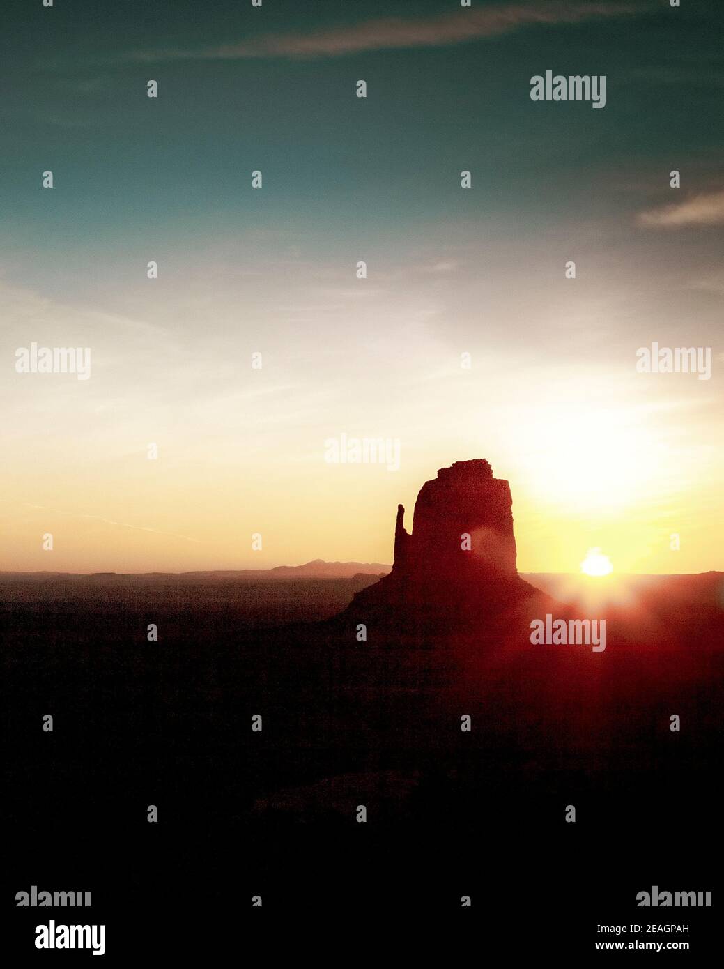 Sunrise breaks in Monument Valley on Arizona/ Utah border. Stock Photo